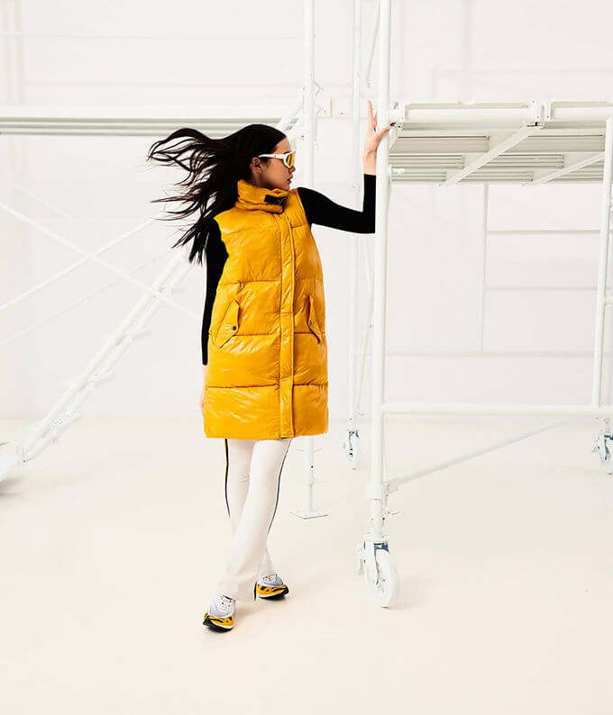 Woman in yellow jacket